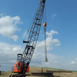 Dragline assembled on the staging pad with the boom raised, ready to begin cleanout
