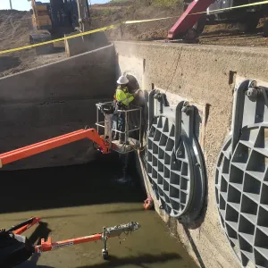 Anchor drilling on the headwall face with two gates already mounted