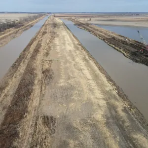 A long straight reach with the shaped top bank running between the channel and the borrow cut