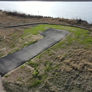 Finished asphalt trail approach tying the new alignment into the existing shoreline path