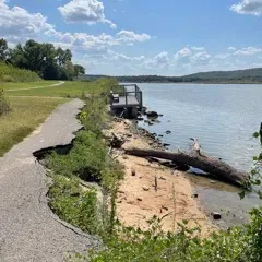 Shoreline erosion and undermining along the existing trail edge