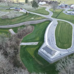 Aerial of the finished expansion — committal shelter, MSE retaining wall and the new roadway loop